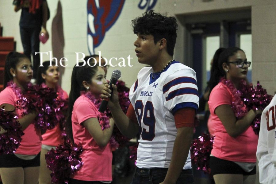 Senior, Martin Rodriguez, singing the national anthem at the Pink Out pep-rally.