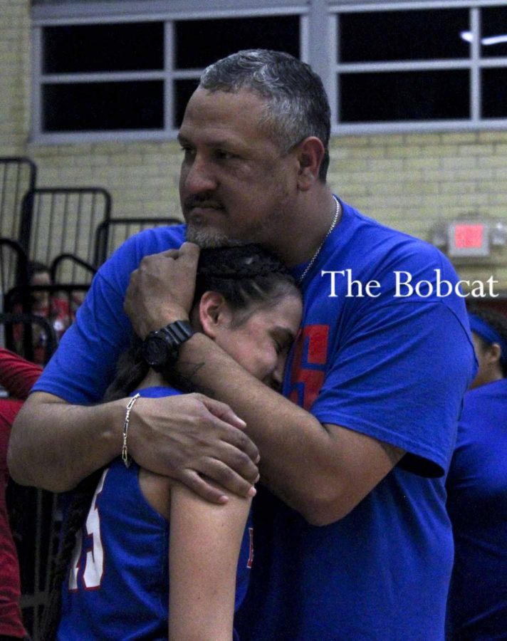 Freshman Julissa Santa Maria is embraced by her father after tough loss against Laredo United.