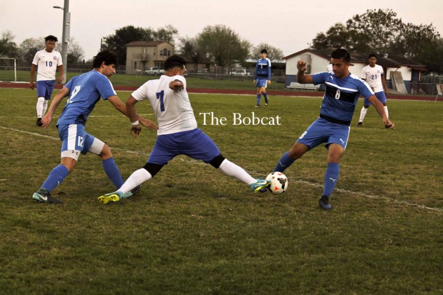 Junior Arturo Garza showcases his flexibility in an attempt to take away the ball.