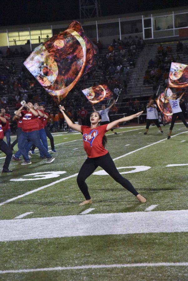 Junior, Angelica Aguirre performing in halftime for their show entitled, On the Contrary for the first game of the season against Harlingen.