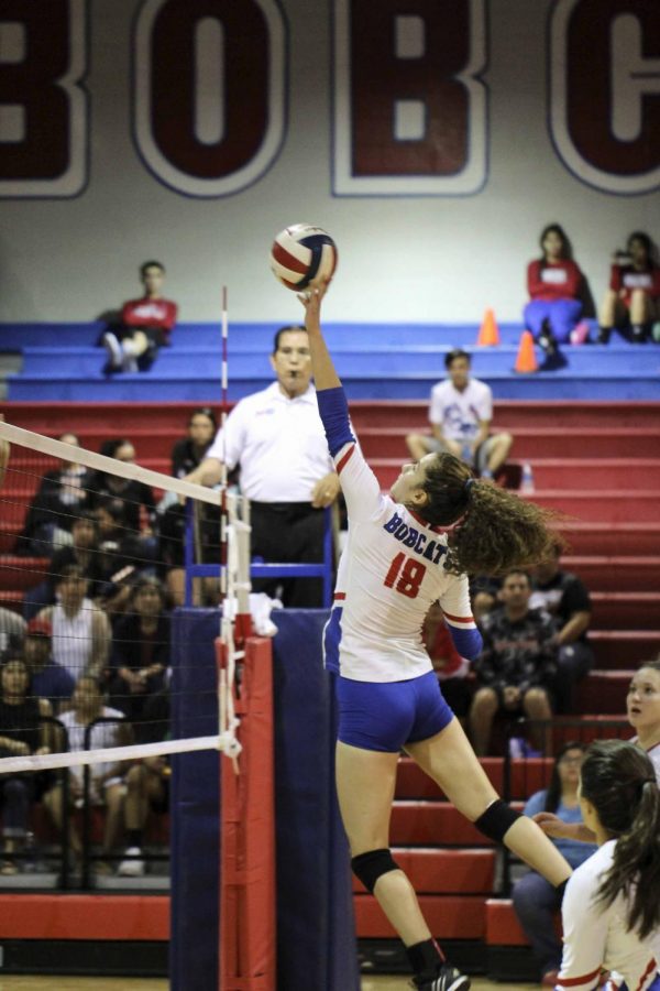Junior, Victoria Fuentes tips the ball against Harlingen during one of the first home games of the season.