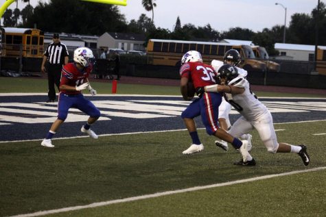 Junior, Shandon Woodard scores a touchdown at the football game against Brownsville Rivera last week.