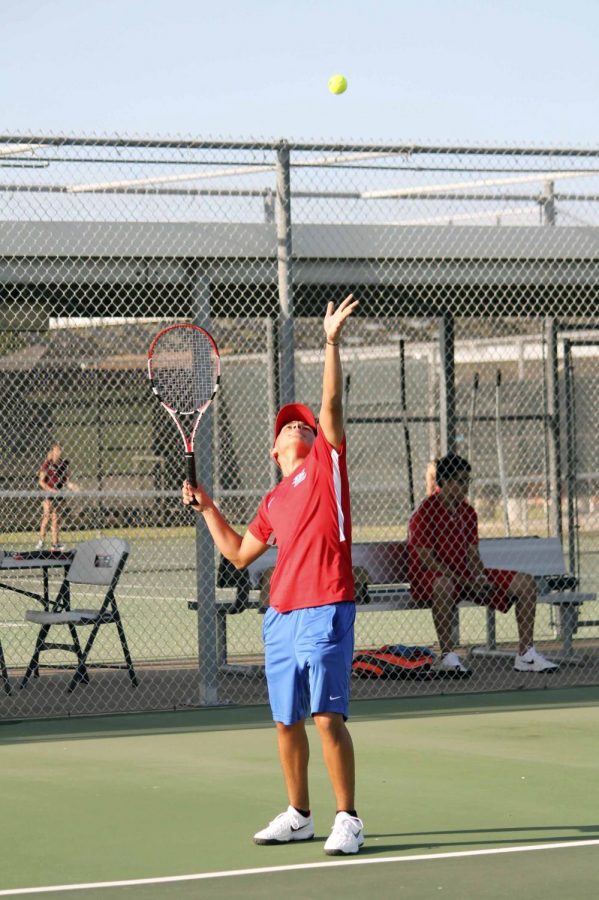 Junior Ricardo Cano serves  during the match against Donna North.
