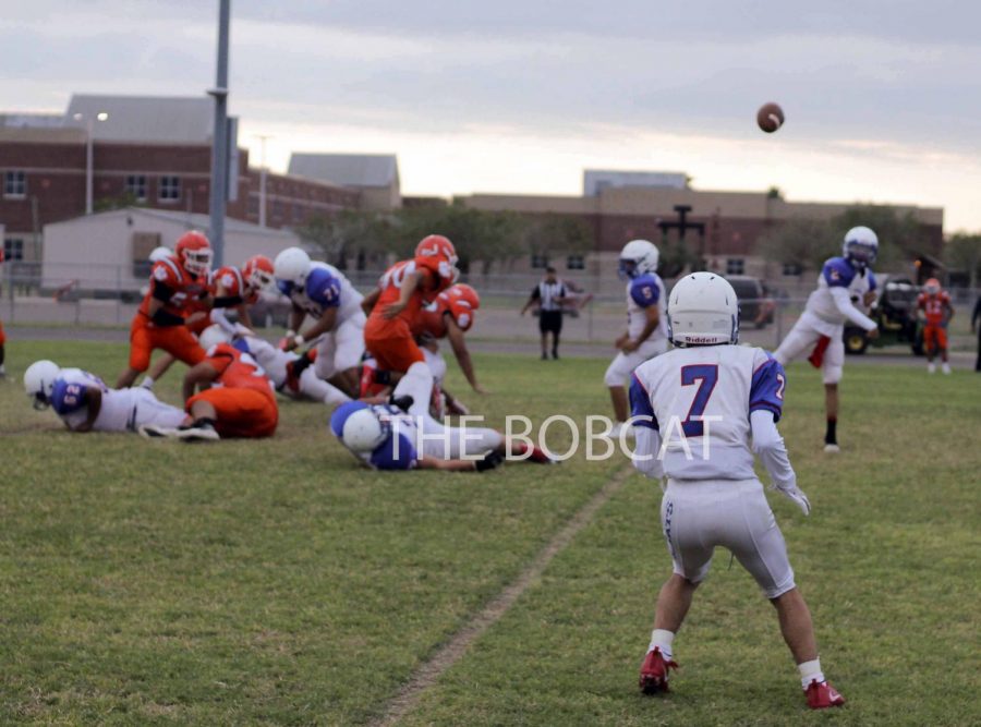 Freshman Raul Ramirez gets in position to receive the ball from the quarterback to make the play against Economedes.