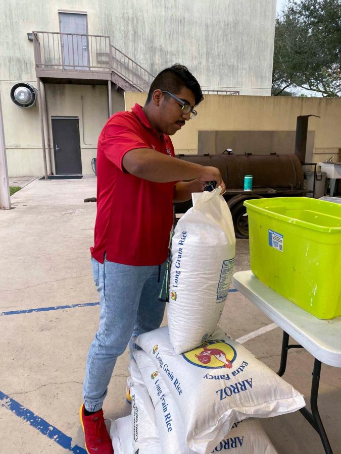 Josue Alvarez begins to prepare food bags for people in the community.
First Baptist Church hosts Providing Hope once a month.