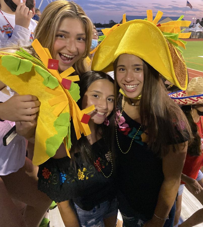 Denisse Valdez, Alyssa Garcia and Shelby Celedon show their school spirit for the Fiesta themed football game.