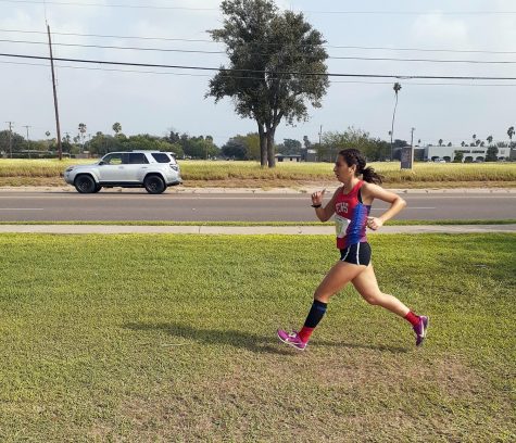 Leah Martinez runs in the District Cross Country Meet at Ebony Golf Course last week. Martinez placed 5th in the JV race with the JV team placing 3rd overall.  I felt determined to not lose to the girl behind me, junior Martinez said.