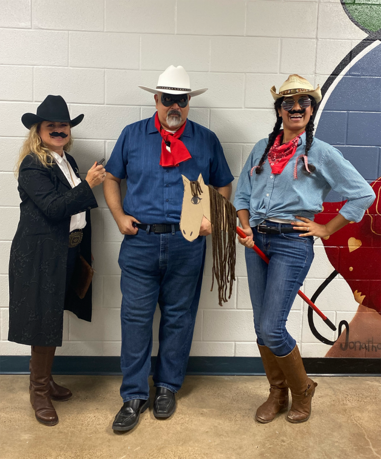 Teachers, Mrs. Saenz, Mr. Ramirez, and Mrs. Clark dress up in their Western attire for the Hoco spirit day.  We love having fun and participating in these occasions, Mrs. Saenz said.  We hope to encourage our students to make the best memories during their high school experience.