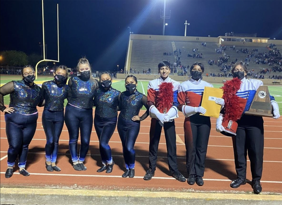Members of band, Krystal Rubio, Evelin Hernandez Vivian Pena, Marilee Garcia, Rosalee Garcia, Jesus Flores, Mya Alejandro and Erica Tovar stand together after winning their Division 1 award at the Pigskin competition.  I felt very proud of our organization and truly felt that all of our hardwork did pay off, Alejandro said.